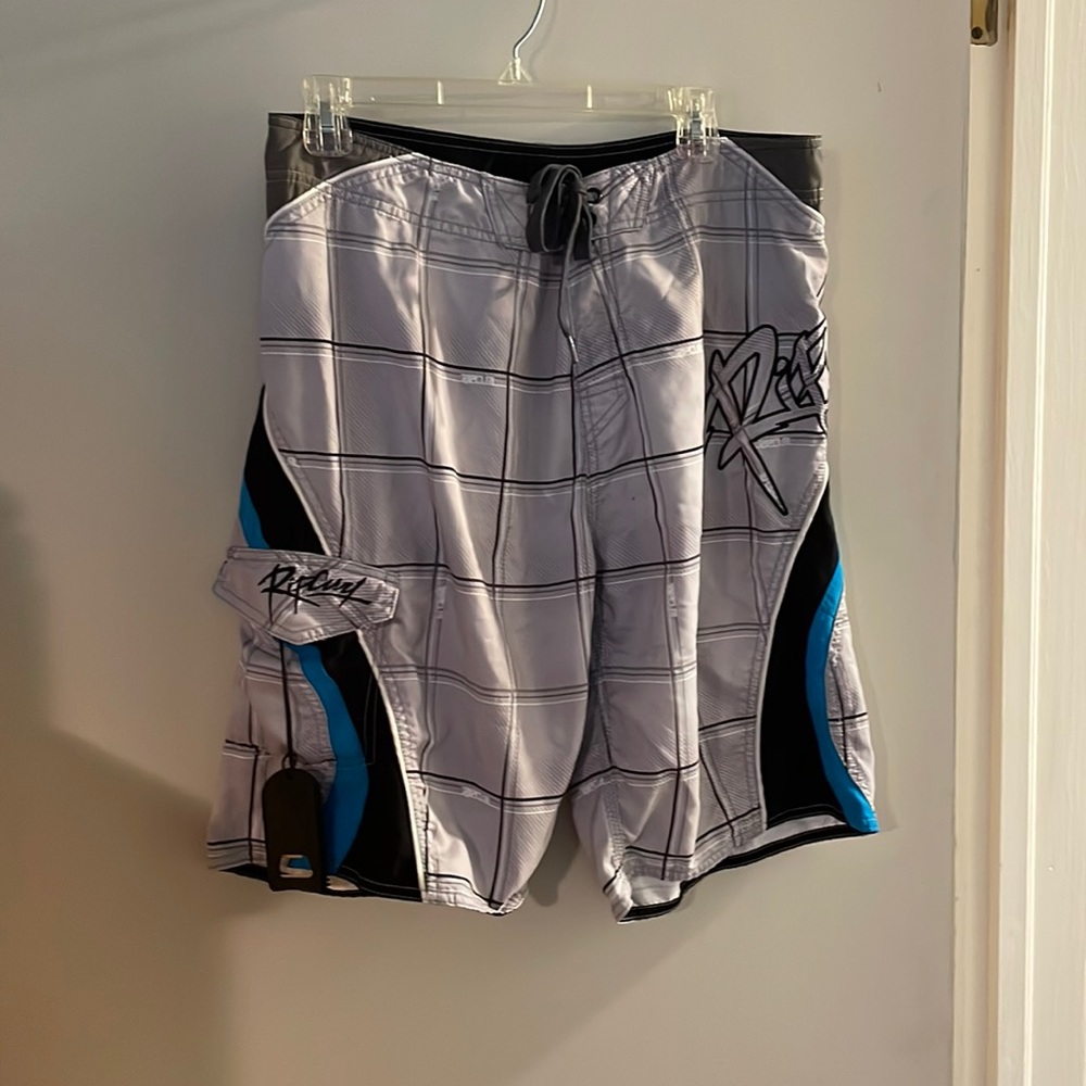 Rip curl board shorts with bottle opener/surf wax comb
